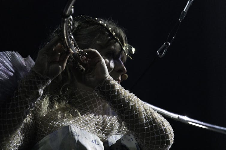 A woman plays the flute