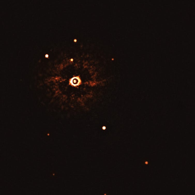 Estrella con dos planetas, imagen directa de ESO