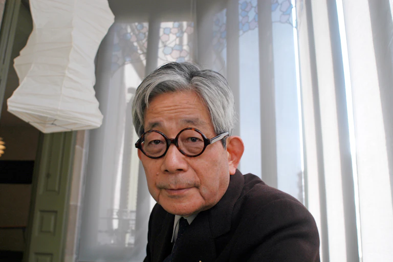 An old man with round glasses.