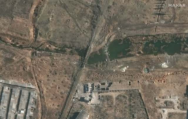 Satellite image of river and destroyed bridge
