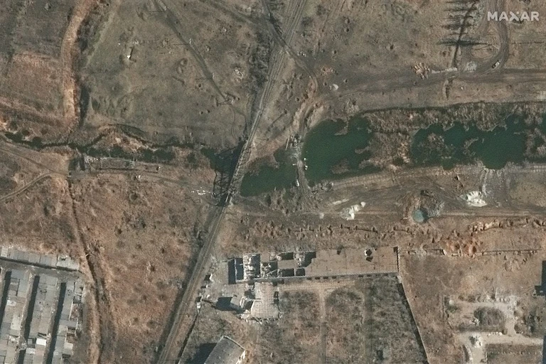 Satellite image of river and destroyed bridge