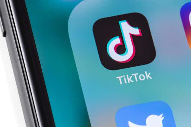 TikTok logo on a smartphone.