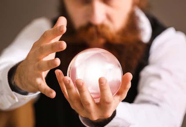 A magician holding a crystal ball