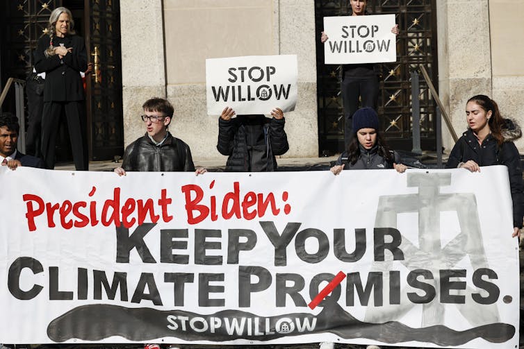 Young protesters hold a sign reading: 'President Biden: Keep Your Climate Promises. Stop Willow.'