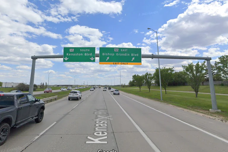 A road sign that says Bishop Grandin Boulevard.