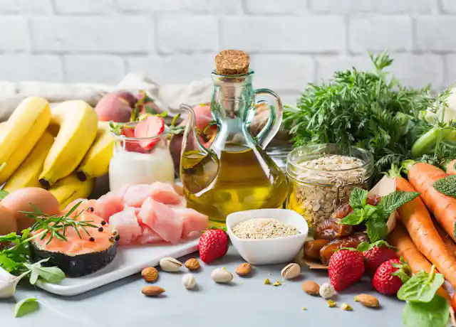 A variety of foods including fruit, vegetables, fish, eggs, nuts, grains and oil