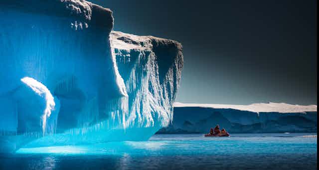 Scientists explore Antarctic icebergs by boat