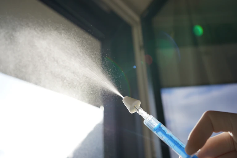 A demonstration of a drug nebulizer, similar to what a naloxone nasal spray would look like.