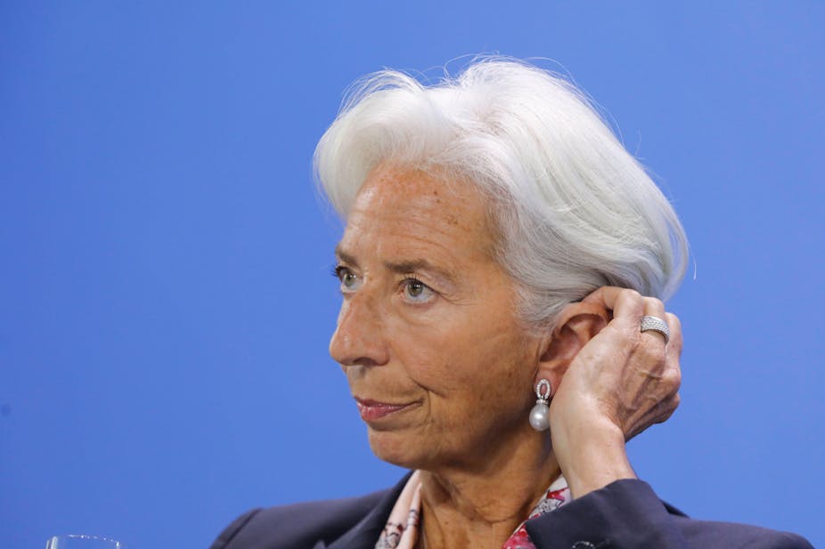 Christine Lagarde rubbing her eat