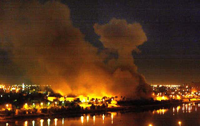 Fires along the river Tigris in Baghdad during US-led bombing raids in March 2003.