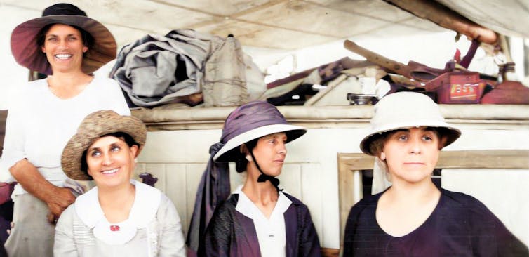 Four women in 1922 aboard a ship.