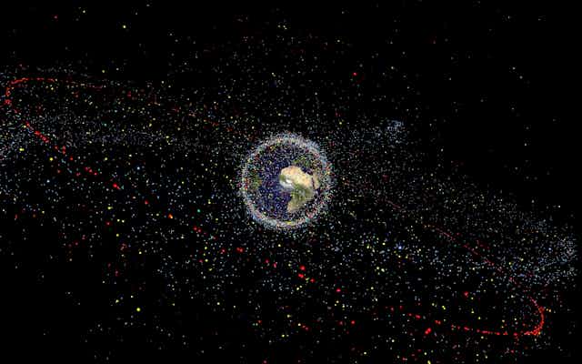 Artist's impression of the Earth surrounded by clouds of satellites and debris.