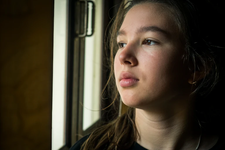 Young girl looking reflective/sad