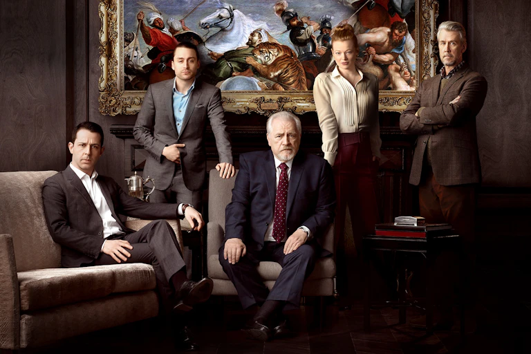 Family dressed in suits poses.