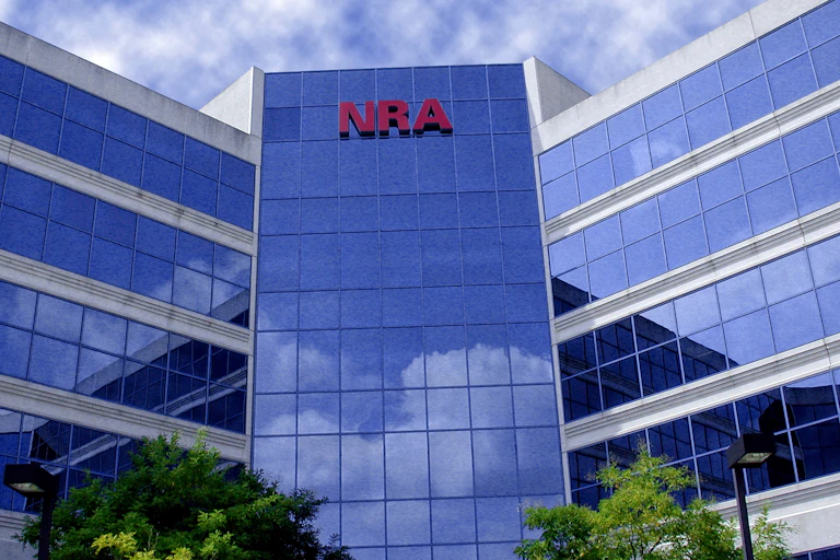 Big glass office building with the letters NRA up top