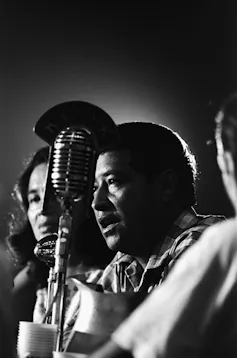 A man speaks into a microphone.