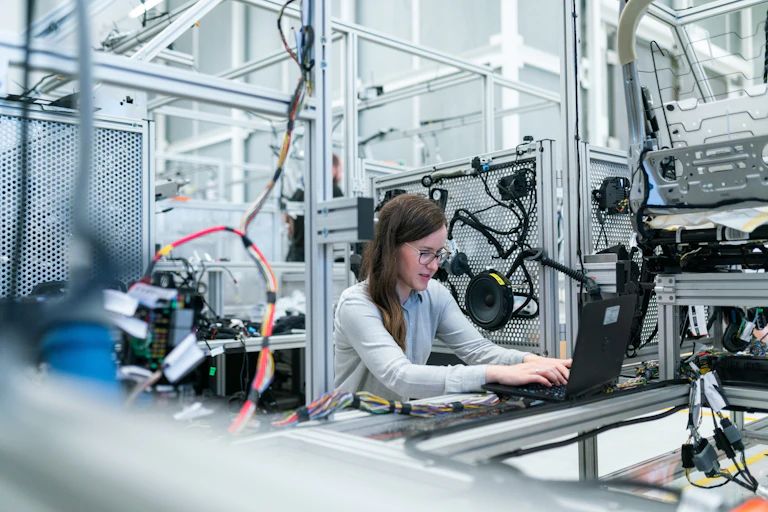 A woman works in an engineering lab.