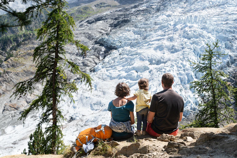 family looks at glacier