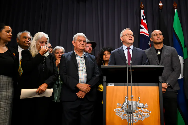 The prime minister was surrounded by members of the First Nations Referendum Working Group during a press conference today, where the wording was announced.