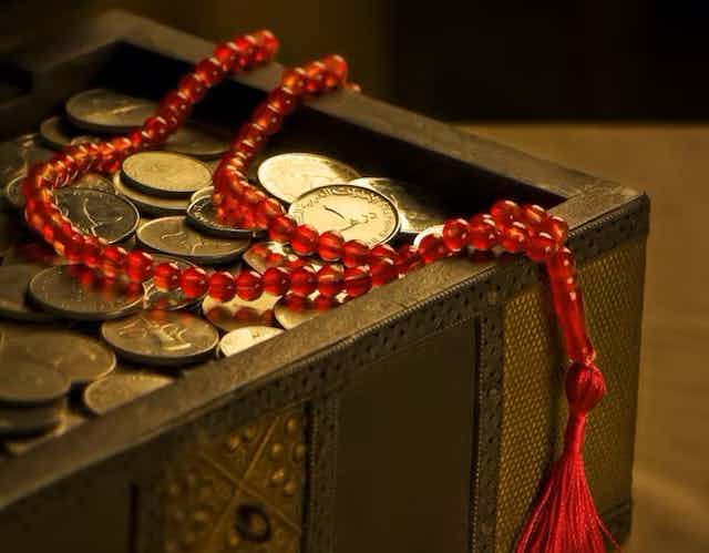Coins and prayer beads