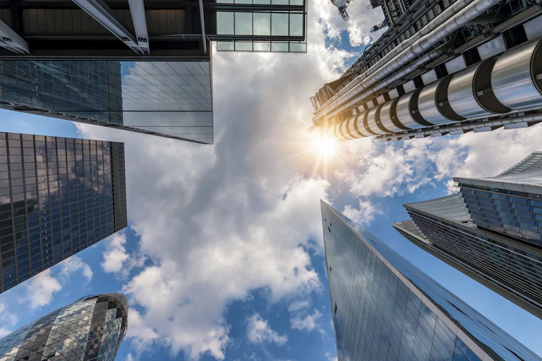 Abstract view to the skyline of London with the modern skyscrapers and a blue summer sky, United Kingdom