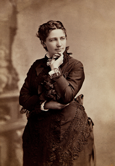 A black and white historical photographic portrait of a woman.