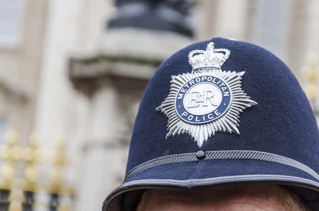 Close up photo of a Met police officer's hat with badge