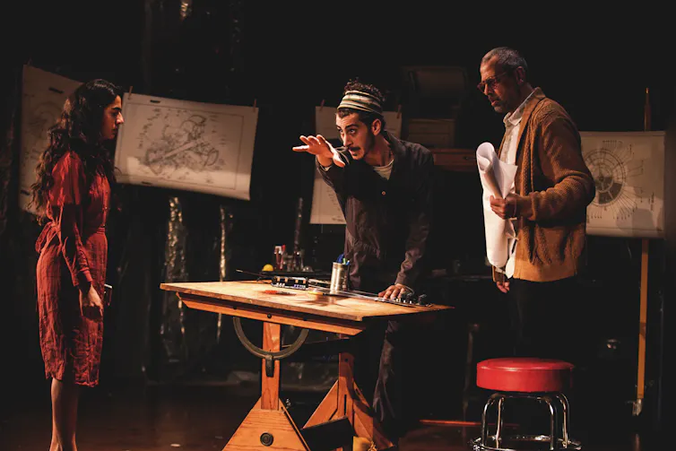 Three actors on stage.