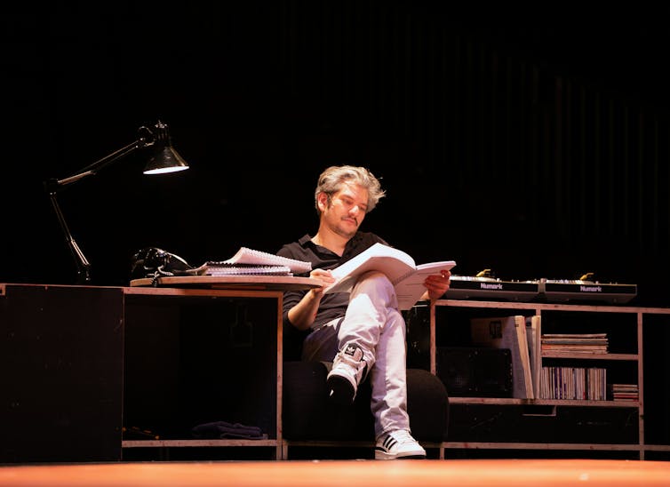 A man reads a magazine.