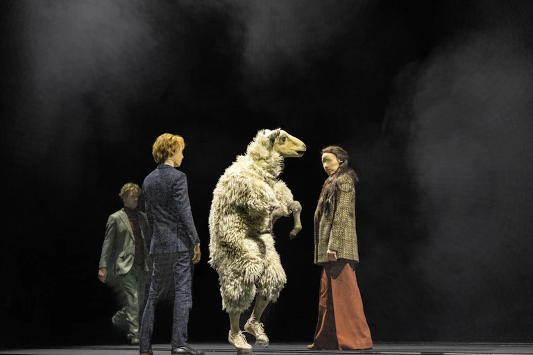 A sheep and three humans.