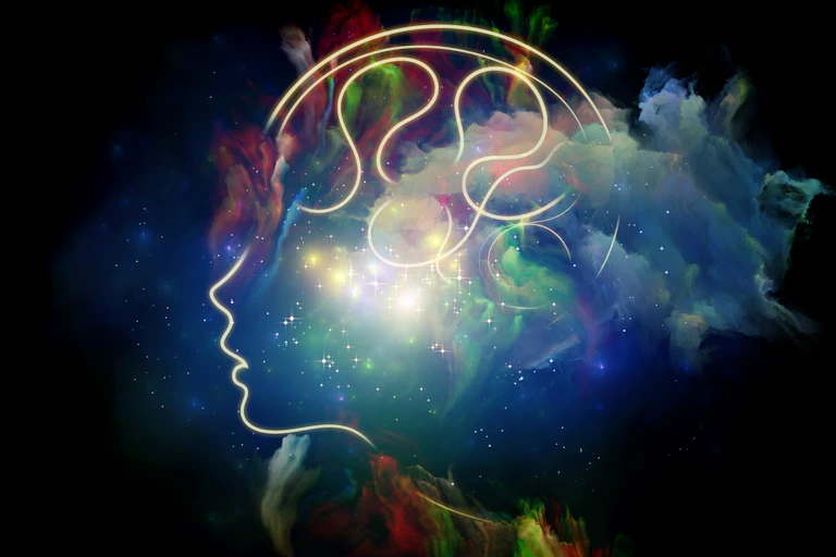 A glowing line drawing of a person with nebula clouds in their head on dark background