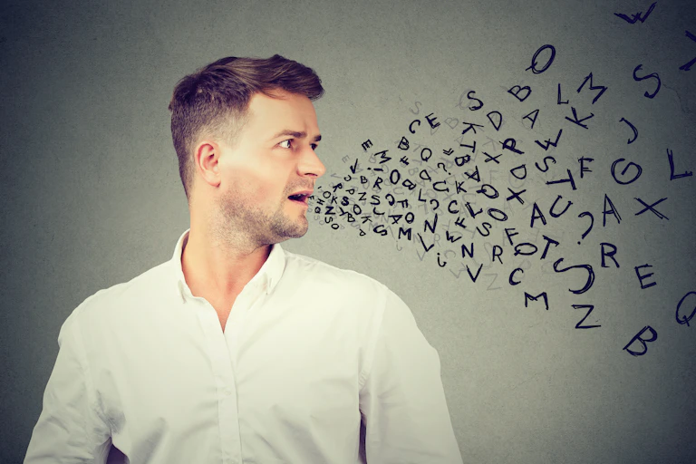 Man talking with alphabet letters coming out of his mouth