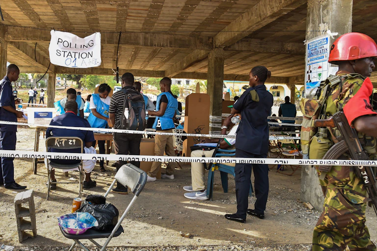 People standing around a polling unit