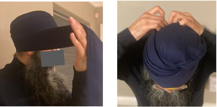 A bearded Sikh man tying a navy blue dastaar as viewed from the side and above.