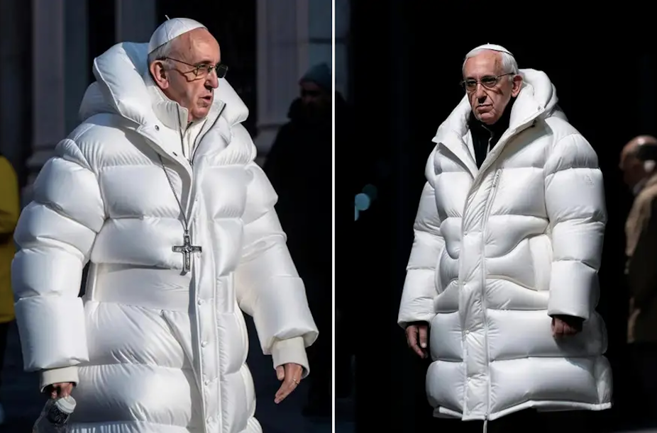 Pope Francis walks in a white exaggerated puffer coat, with a cross pendant worn over the top. 