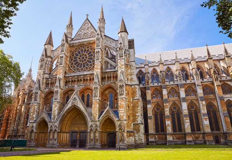 The imposing building of Westminster Abbey in the sunshine.