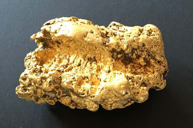 A photo of a large gold nugget.