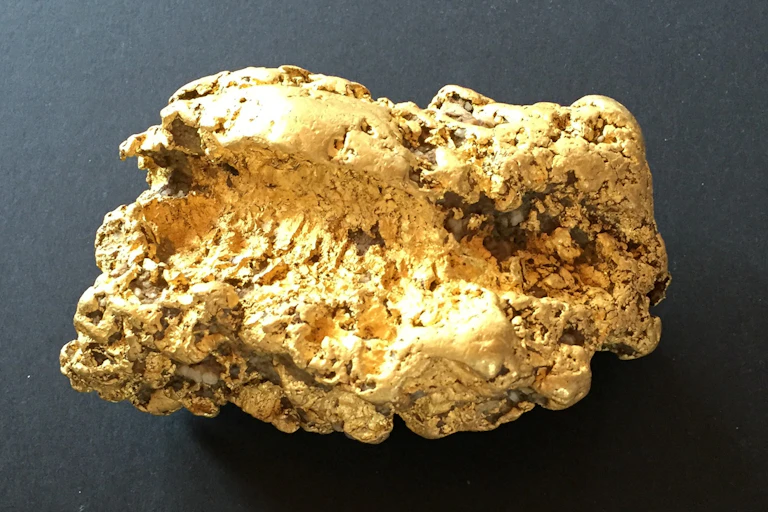 A photo of a large gold nugget.