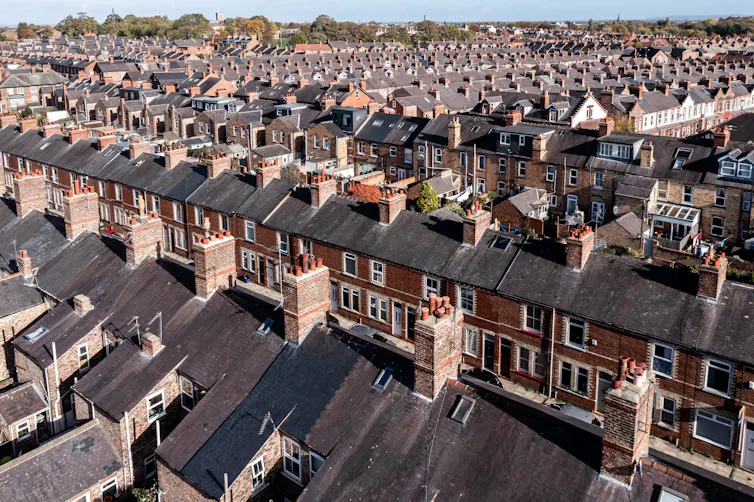 An aerial view of rows of terraced housing.
