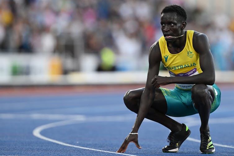 Peter Bol on the track after winning a silver medal in the men's 800 metre final at the 2022 Commonwealth Games.
