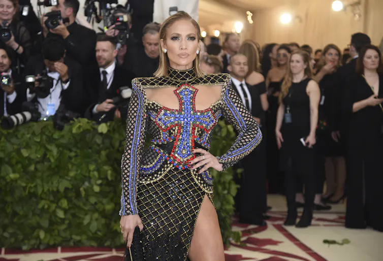 JLo with a large cross on her dress.