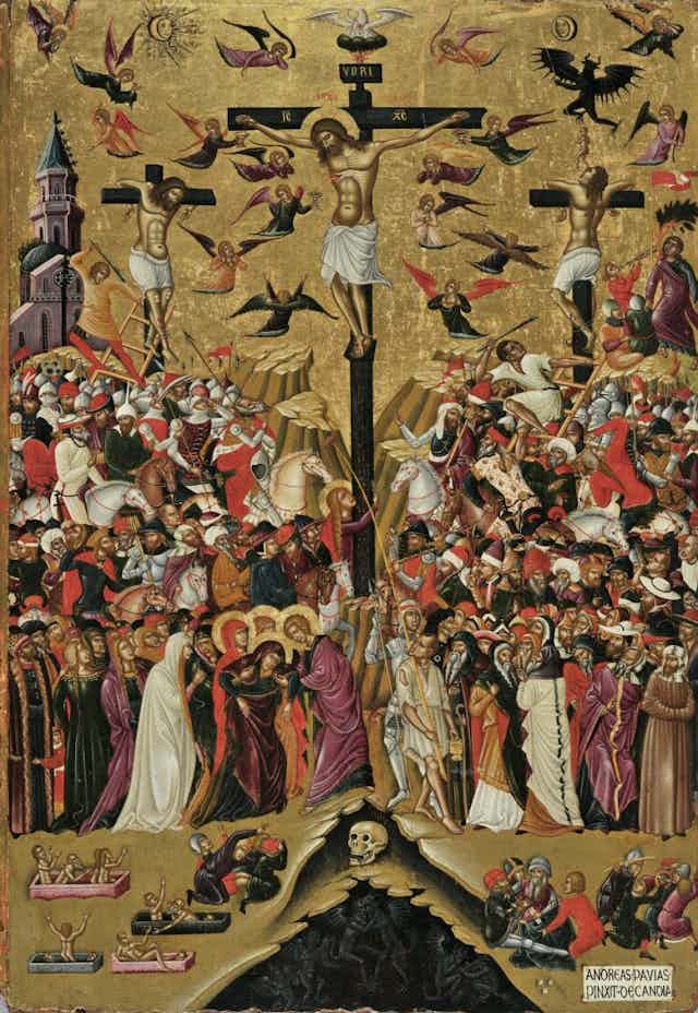An ornate painting: three people on crosses, angels in the air and a mass of bodies below.