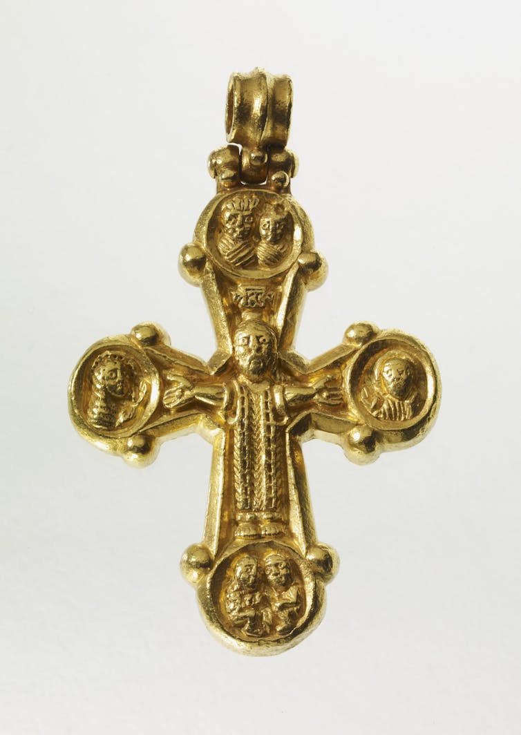 gold with loop and expanding arms which terminate in oval medallions; in the centre Christ crucified