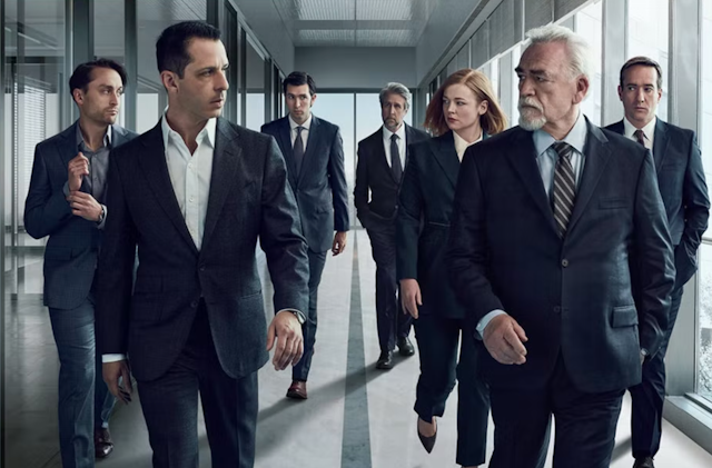 The cast of Succession walking down a corridor in black suits eyeing each other with suspicion.