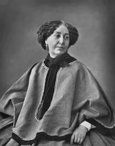 A black and white photo of a woman sitting down