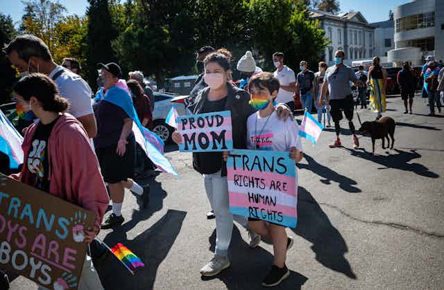 mother and child in pro trans protest