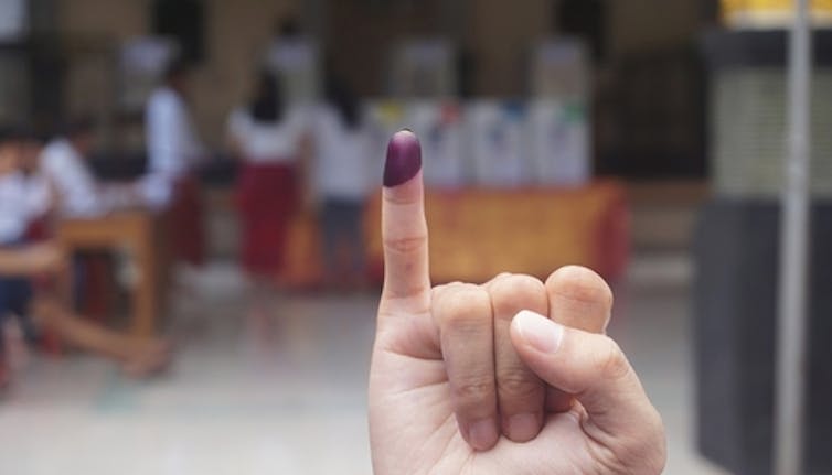 Purple ink on finger after presidential election in Indonesia.