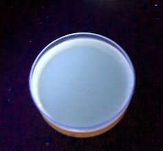an aerial photo of a cup with glowing liquid