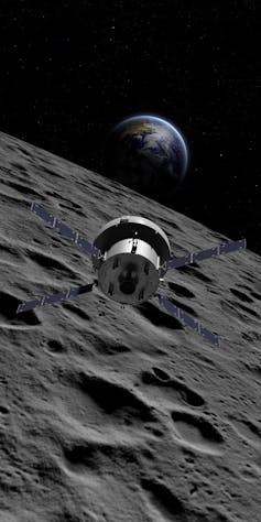 An artist's impression of a spacecraft flying over the surface of the Moon.
