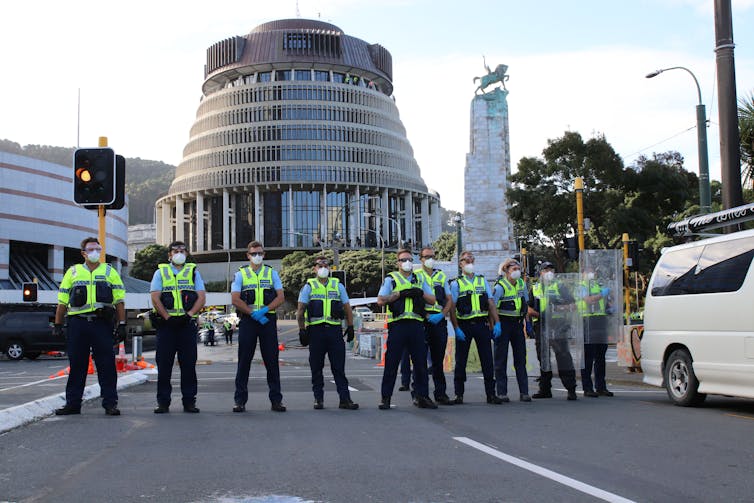 Police block the road to the Beehive